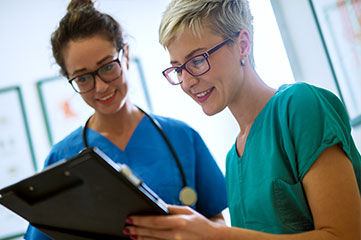 Registered Nurse helping a patient